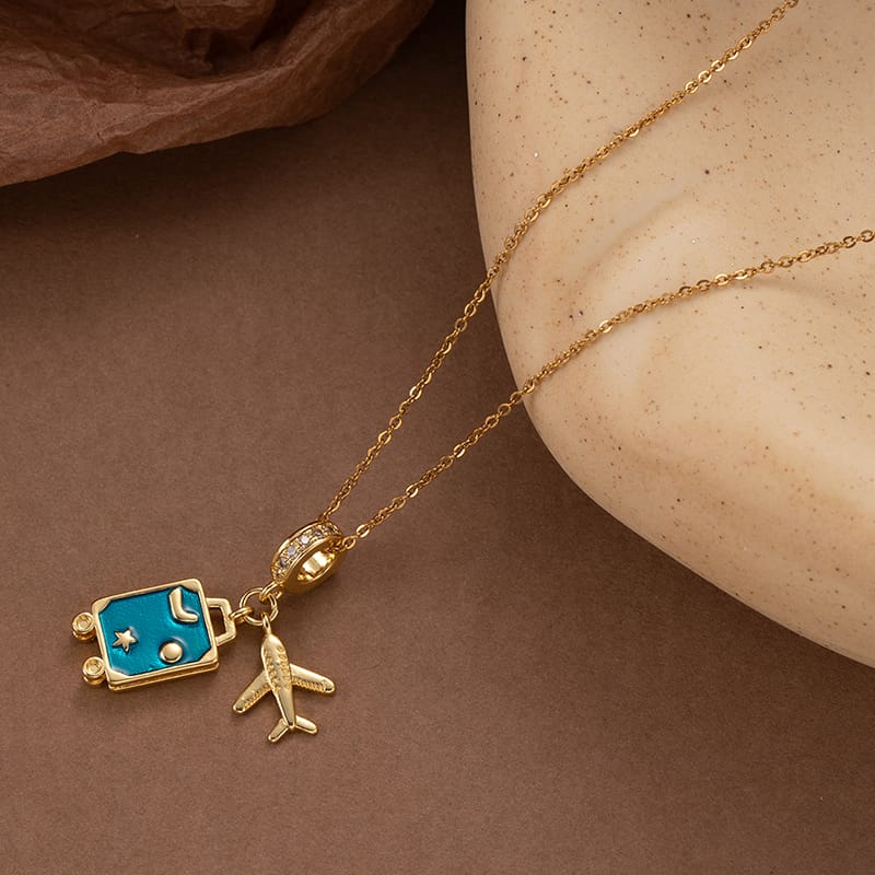 Stylish Gold-Plated Travel-Themed Pendant Necklace for Women and Girls – Featuring Airplane and Blue Suitcase Charms with Adjustable Chain